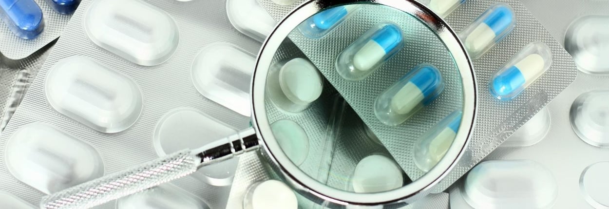 Tabletter under en optisk linse