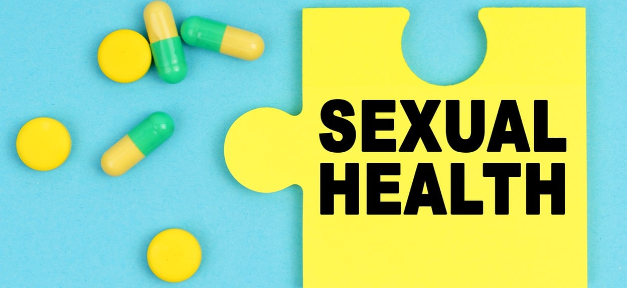 illen und ein Puzzle mit der Aufschrift - SEXUAL HEALTH